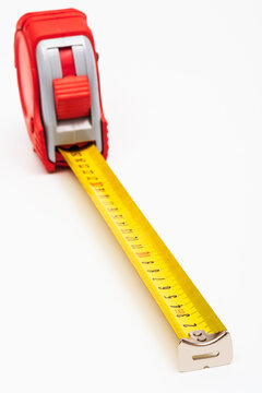 Red new tape-measure on white background