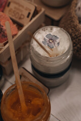 Glass jars with body creams or butter. Spa and beauty concept. Care cosmetics
