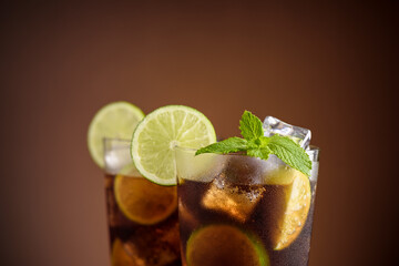 Cuba Libre cocktail. Alcoholic drink with cola, rum, lime and mint. Cuba Libre or long island iced...