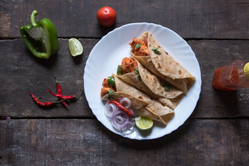 Ready to eat Burrito or tortilla meat wraps served. Top view. It is also known as chicken wraps in the Indian subcontinent. 