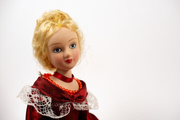 Ceramic doll. Blonde in vintage red dress