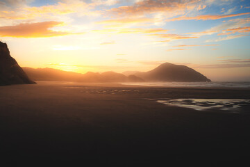 Fototapeta na wymiar Sunrise at Wharariki beach, New Zealand