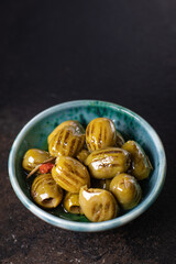 grilled olive fresh fruit olives in plate ready to eat meal snack on the table copy space food background rustic. top view keto or paleo diet veggie vegan or vegetarian food