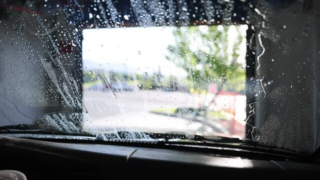 Moving forward through the drying section of a touchless carwash.