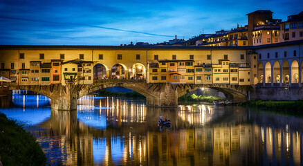 Evening view of the famous bridge Ponte Vecchio on the river Arno in Florence, Italy. The  Ponte Vechio bridge is one of the main attractions in Florence.