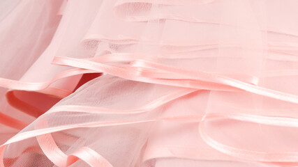 Wedding dress detail. Pink wedding dress frills close up.