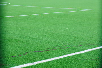 new soccer field, green turf and white dividing lines on the soccer field, corner and edge of the...