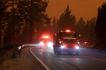 Firefighters battleing fire as Flames approaching Highway 50 during Caldor Fire in California