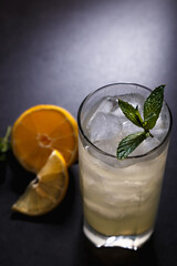reshly squeezed lemonade with mint in a tall glass with ice.