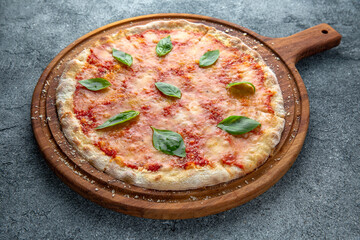 Tasty hot italian pizza Classic Margherita (Margarita) with Mozzarella Cheese, Tomato Sauce, Basil. Pizzeria menu. 