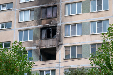 Fototapeta na wymiar Windows of an apartment building after a fire