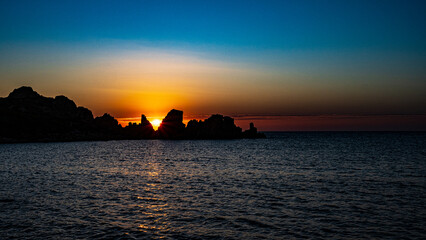 Naklejka na ściany i meble sunset view to the sea with coastline. Sardinia, Italy.