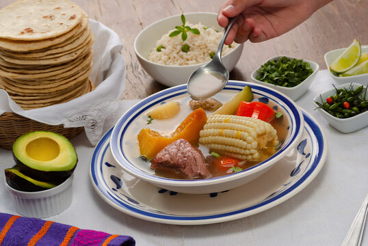 "Caldo de res" is a traditional Guatemalan beef soup made with pieces of meat and vegetables served with rice, vegetables, and tortillas. 