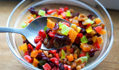 colored candied fruits on a wooden board.  candied peel pieces