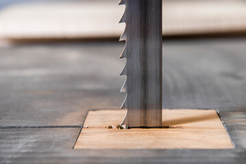 The blade of a saw of an industrial machine in a carpentry workshop