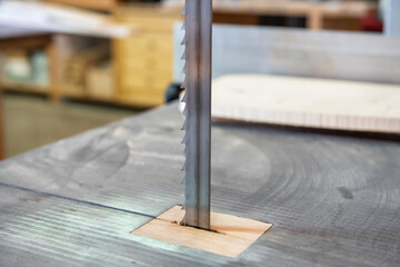 The blade of a saw of an industrial machine in a carpentry workshop