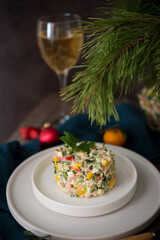 New Year's holiday salad with mayonnaise, New Year's table, champagne