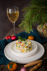 New Year's holiday salad with mayonnaise, New Year's table, champagne