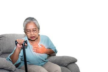 Asian elderly woman, sitting on a sofa and holding walkers in home, are suffering from angina Due...