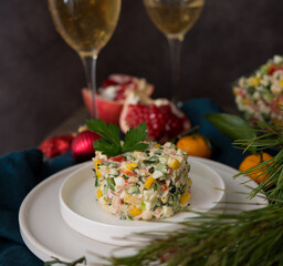 New Year's holiday salad with mayonnaise, New Year's table, champagne