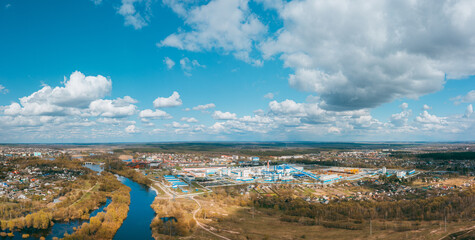 Fototapeta na wymiar Aerial View Of Modern Paper Factory In Sunny Spring Day. Bird's-eye View Of Dobrush Cityscape. Dobrush, Gomel Region, Belarus