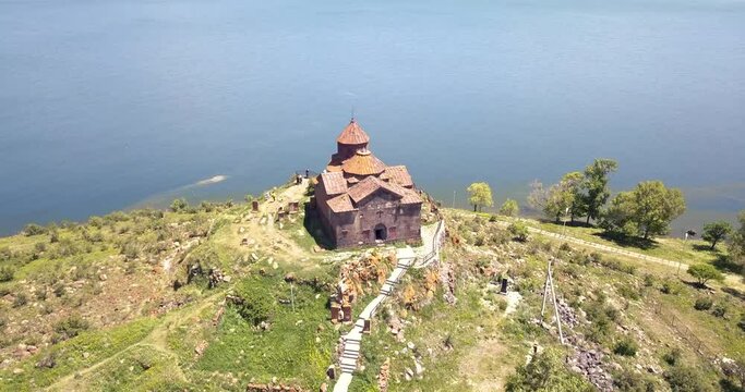 famous ancient monastery of Hayravank in Armenia with the legendary Lake Sevan. Strong contrast and film grain filter added.