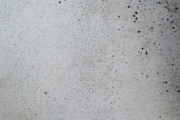 texture of white stone with black splashes close up
