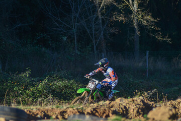 View from afar of a boy doing motocross