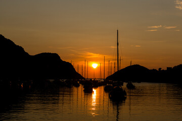 sunset, boats in the harbour
