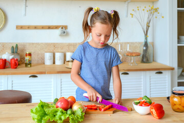 little cute girl cooking in the kitchen