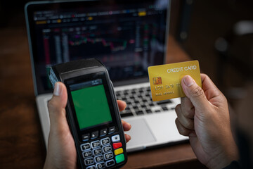 Man hands holding credit card and using laptop or smart phone Online shopping Website,Payment transaction with card,Easy Ecommerce Website Shop Online by Smartphone.Online shopping concept.