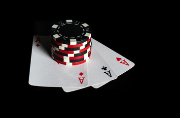 Obraz premium Poker game with three of a kind or set combination. Chips and cards on the black table. Successful and win. Free advertising space