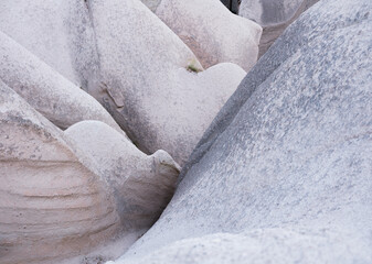 Rocks as a background. Smooth lines of rocks as a design image. Natural abstraction.