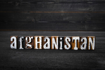 Afghanistan, Political, Humanitarian and Cultural concept. White wooden letters on a dark wooden background