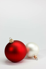 Red, white glass Christmas tree on a light background. postcard