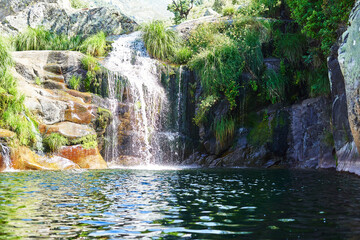 landscape of a river, natural pool with waterfall