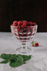 Fresh raspberry in glass vase