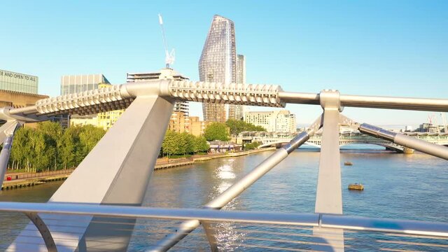 Millennium Footbridge over Thames river, One Blackfriars modern skyscraper