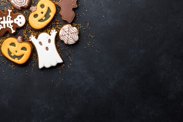 Halloween gingerbread biscuits on black background
