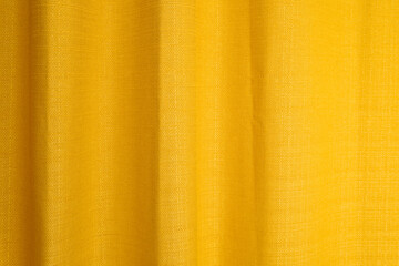 Fabric yellow curtains with folds . Abstract background, curtain, drapes gold fabric.