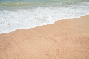 Blue wave and white foamy nature on sunny summer day.Fantastic colorful sunset on surfing  beach.