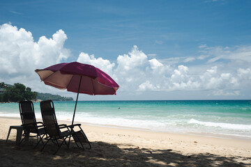 Umbrella and chairs colorful to sleep and relax on the beach.