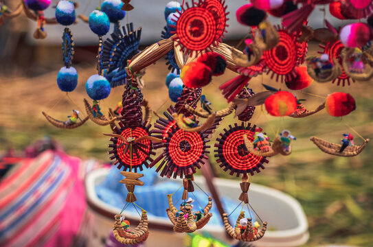 Local colorful souvenirs at Uros floating Islands in Titicaca Lake, Puno, Peru 