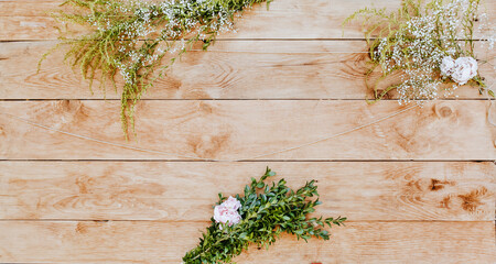 Light wood decorated with plants and flowers. Wooden texture background mockup background