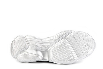 White and black leather sneakers. Casual women's style. White rubber soles. Isolated close-up on white background. Shoe sole view. Fashion shoes.