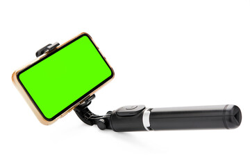Selfie stick with smart phone isolated on white background. clipping path .