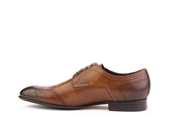 A classic leather elegant brogues men's shoes isolated white background. Groom's stylish brown shoes. Isolated object close up on white background. Left shoe view.