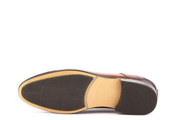 A classic leather elegant brogues men's shoes isolated white background. Groom's stylish brown shoes. Isolated object close up on white background. Shoe sole view.