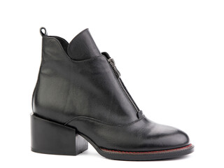 Women's autumn ankle black leather boots with black zip and average heels, isolated white background. Right side view. Fashion shoes. Photoshoot for shoe shop concept.