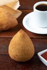 Coxinha of chicken, traditional Brazilian snack .